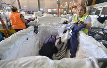 Wworkers sorting out clothing at the St Vincent de Paul Society, a major charity recycling clothes, in Sydney.