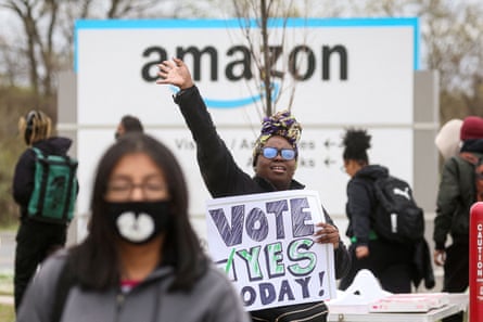 An Amazon Labour Union (ALU) organizer greets workers outside Amazon’s LDJ5 sortation center, as employees begin voting to unionize a second warehouse in the Staten Island, on 25 April 2022.