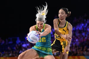 Gretel Bueta of Australia and Shamera Sterling of Jamaica compete for the ball during their netball group match.