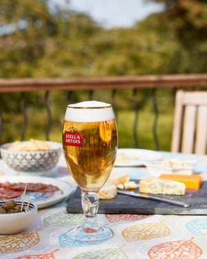 A glass of Stella Artois on a garden table