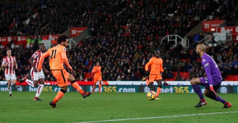 Liverpool’s Mohamed Salah scores their third goal.