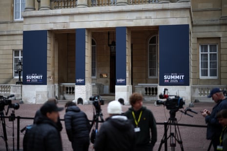 Members of the media work ahead of the UK-EU Summit at Lancaster House, in central London.
