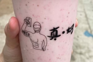 A milk tea shop includes a caricature of a protester and the word “HKER” for Hongkonger on their cups