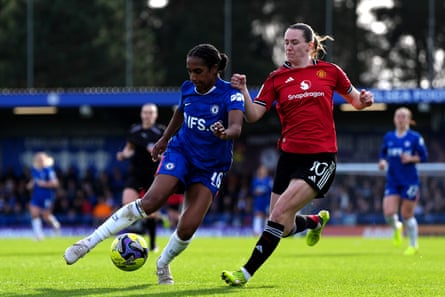 Chelsea’s Naomi Girma (left) is.challenged Manchester United’s Elisabeth Terland