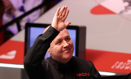 John Higgins smiles and salutes the crowd after a 10-6 victory against Jamie Jones