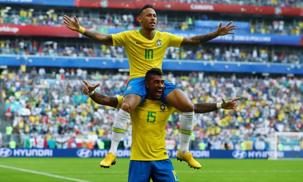 Brazil’s Neymar celebrates with Paulinho after opening the scoring.