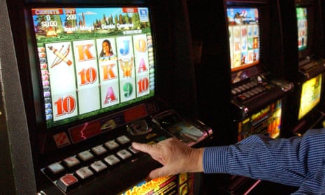 A punter playing the poker machines