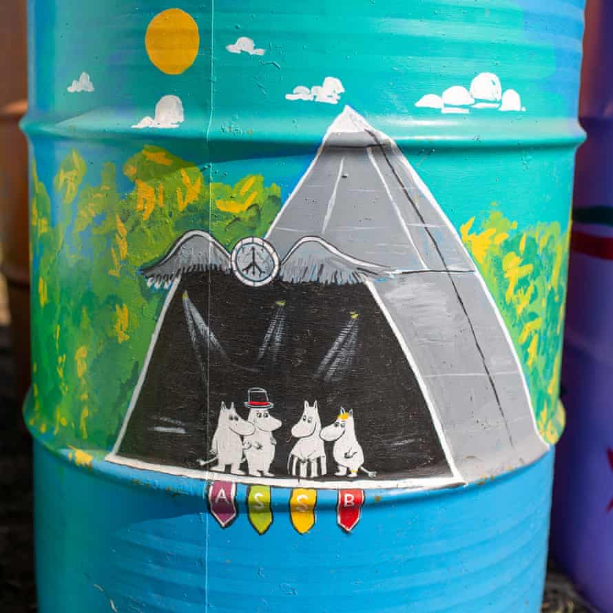 A bin painted for Dan Tastic Glastonbury’s charity fundraiser shows Moomins performing on the pyramid stage. Artwork by Tom Clayton and Russ Lloyd