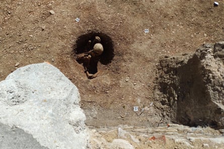A skeleton in a hole viewed from above