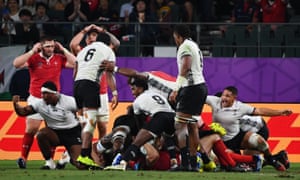 Fiji???s players react after they are awarded a penalty try.