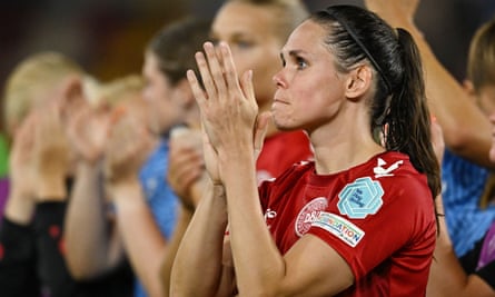 A dejected Simone Boye Sorensen applauds the Denmark fans.