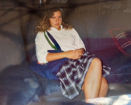 a photo of a woman in a white shirt and plaid skirt