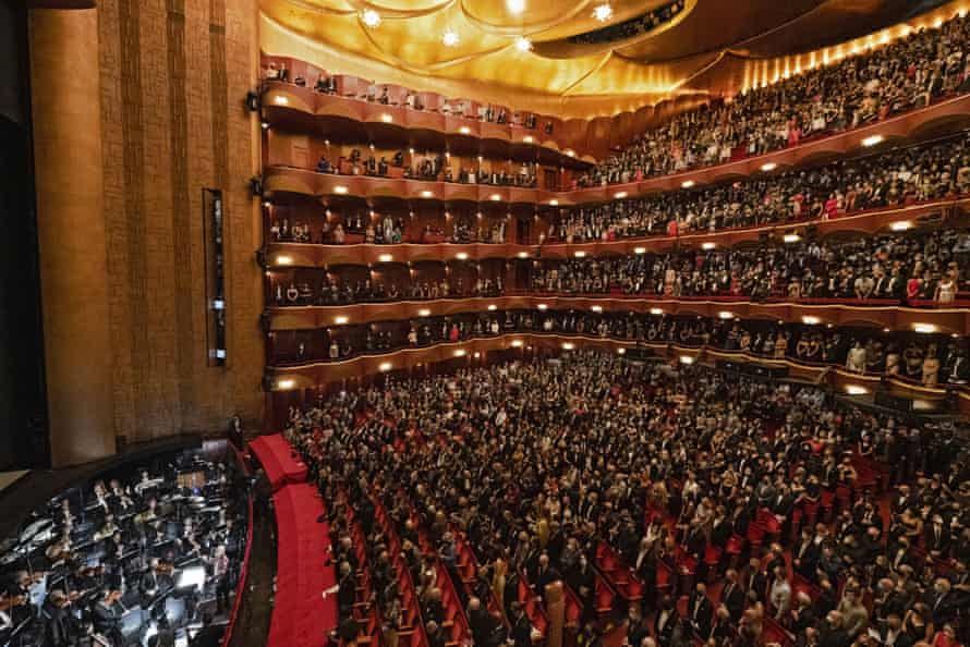 The audience stands for the national anthem before the performance of Terence Blanchard’s Fire Shut Up in My Bones.