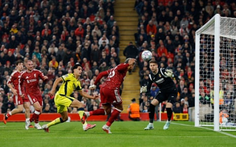 Ronald Araujo heads the ball past a goalkeeper to score for Liverpool