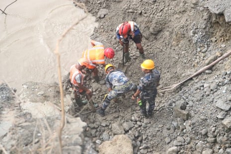Nepal army soldiers work during a search and rescue operation near the Hydropower Project sites in the Rasuwa district of Nepal.