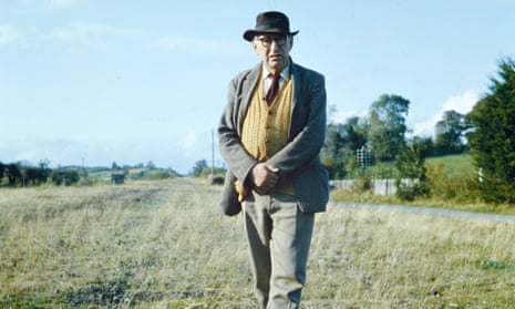 Patrick Kavanagh walking in a field in Inniskeen, Co. Monaghan, in 1963.