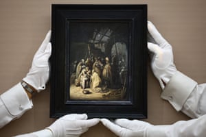 London, UK: Gallery assistants hold a work by the Dutch artist Rembrandt van Rijn