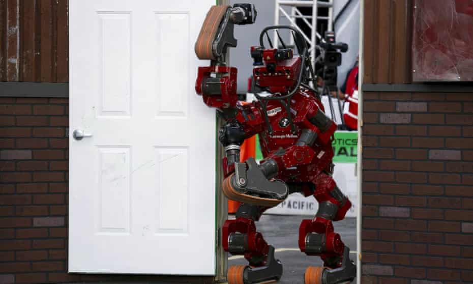 Team Tartan Rescue's Chimp robot walks through a doorway during the finals of Darpa's Robotics Challenge.