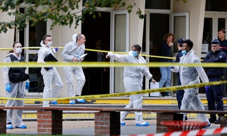 Forensic officers attend the scene.