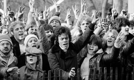 An estimated crowd of 50,000 to 100,000 people take part in a vigil for John Lennon at New York’s Central Park, 14 December 1980.