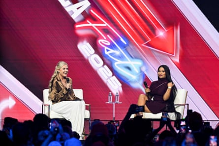 Erika Kirk, left, and Nicki Minaj react during AmericaFest, the first Turning Point USA summit since the death of Charlie Kirk, in Phoenix, Arizona, on Sunday.