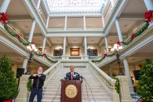 brad raffensperger behind podium