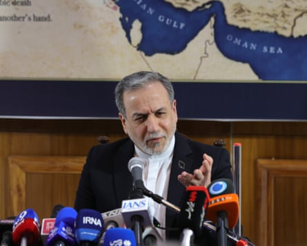 Iran’s foreign minister, Abbas Araghchi,, speaks at a press conference in New Delhion Friday with a map showing the strait of Hormuz in the background
