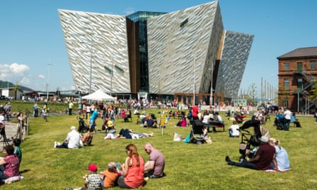 People sit outside the Titanic Museum.
