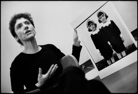 Diane Arbus with her photograph Identical twins, Roselle, NJ 1966, during a lecture at the Rhode Island School of Design in 1970.