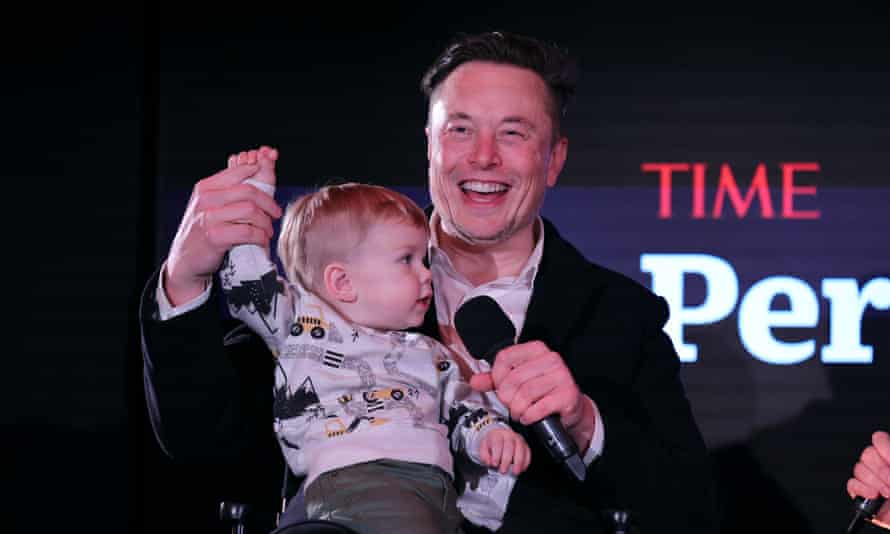 Elon Musk and his son, X Æ A-12, on stage in New York.