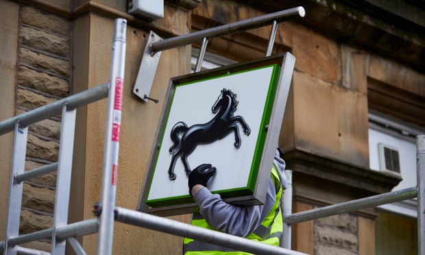 Workmen dismantle the Black Horse signs after the Lloyds Hebden Bridge branch closed for the final time in 2019. 