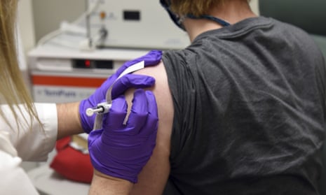 A patient enrolled in Pfizer’s Covid-19 vaccine trial at the University of Maryland School of Medicine in Baltimore receives a shot