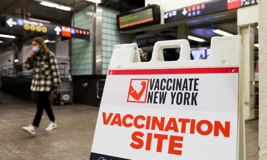 Signage for a vaccination site is seen in a subway station as the Omicron coronavirus variant continues to spread in New York City on Wednesday.