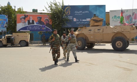 Afghan security forces patrol in Kunduz during a Taliban attack on Saturday.