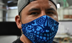 A worker in Mexico wears protective mask in Mexico City, 16 Jul 2020.