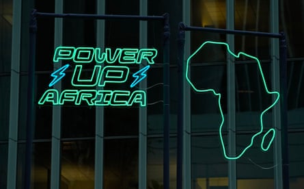 Logo of a map of Africa in green neon with the words ‘Power up Africa’