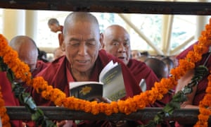 A Tibetan monk in exile prays at the Tibetan main Temple in north India town Dharamsala, India.