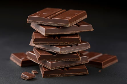 A stack of dark chocolate on a black background