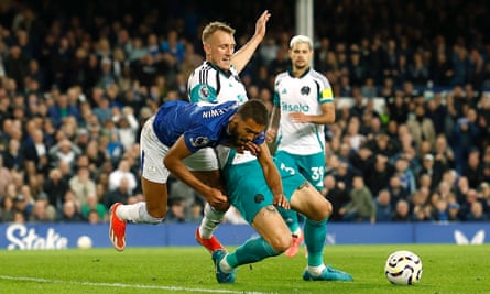 Dominic Calvert-Lewin and Dan Burn clash in the Newcastle penalty area.