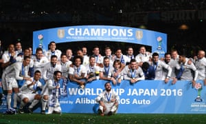 Real Madrid celebrate with the trophy.