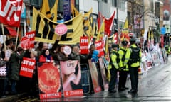 Police walk around abortion protestors holding up placards outside the Marie Stopes clinic, the first private clinic to offer abortions to women in Belfast.