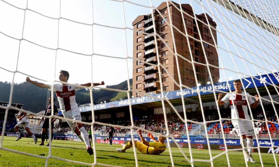 Huesca players celebrate a goal in their win at Eibar.
