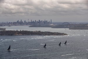 Yachts sail outside the Sydney Heads during the 2021 Sydney to Hobart race
