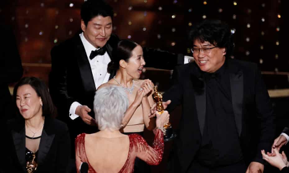 Bong Joon-ho receives his best picture Oscar from Jane Fonda. 