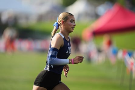 a woman runs on a track