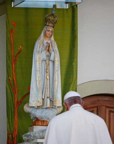 The pontiff prays in front of the statue of Our Lady of Fátima at the Chapel of the Apparitions.