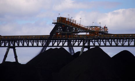 Coal is unloaded onto large piles at the Ulan Coal mines near the central New South Wales rural town of Mudgee in Australia