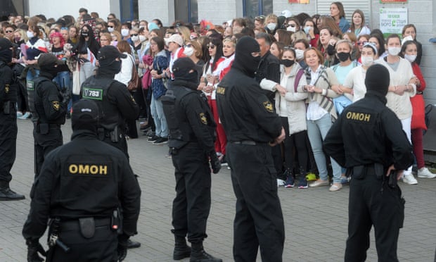 Belarusian police prepare to detain participants of the all-women protest in Minsk.