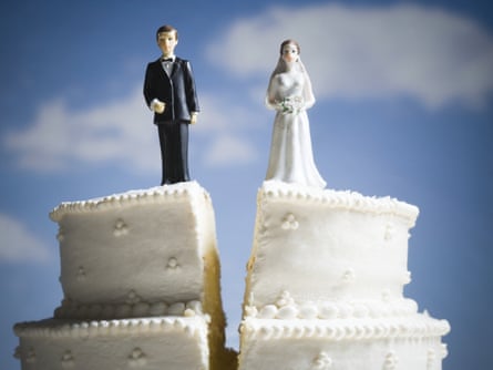 Wedding cake visual metaphor with figurine cake toppersRoyalty-Free Stock Imagery by Rubberball
