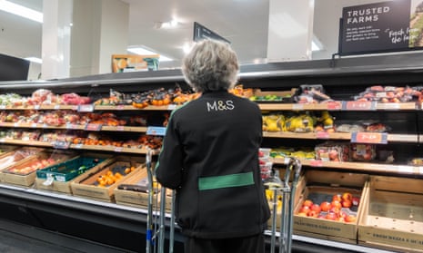 Female employee in food hall of M&S